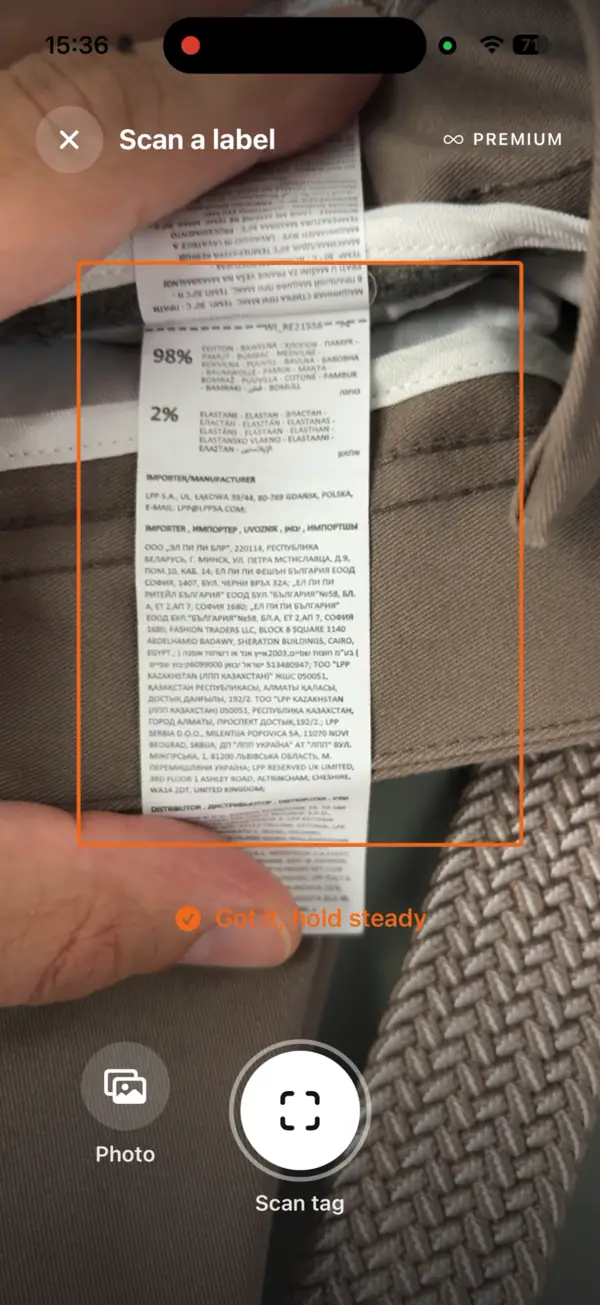 Scanning a label: the frame over a real care label, with the app confirming it has it